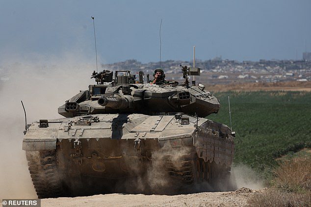 Israel says tent camp blaze that killed 45 Palestinians and sparked international outcry could have been caused by exploding Hamas weapons cache – as IDF tanks roll into the centre of Rafah